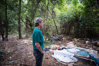 Thomas in past camp in the woods.