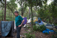 Thomas in past camp in the woods.